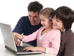 Photo of Parents signing up daughter for swin class via the internet